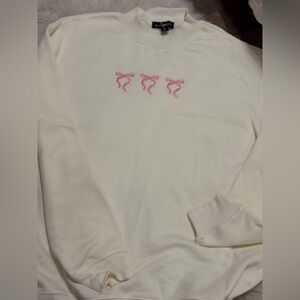 Cream Sweatshirt with Pink Bow Accents